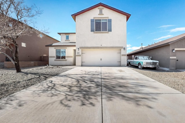 view of front of property with a garage, driveway, and stucco siding