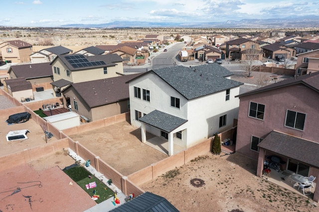 aerial view featuring a mountain view and a residential view