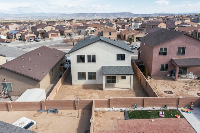 drone / aerial view with a mountain view and a residential view