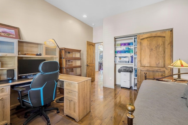 office space with hardwood / wood-style floors and recessed lighting