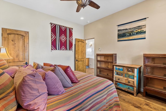 bedroom featuring ceiling fan, wood finished floors, and recessed lighting