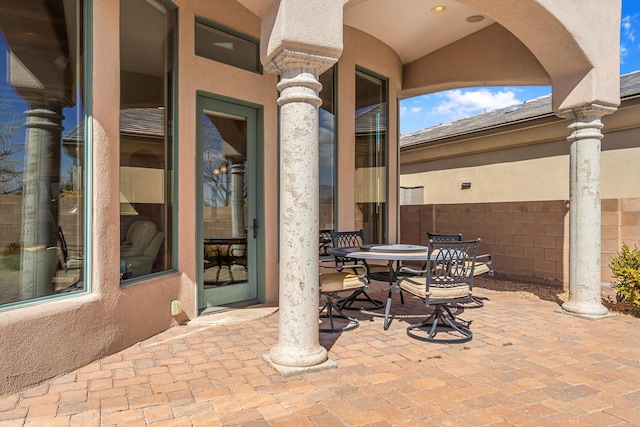 view of patio / terrace with outdoor dining area and fence