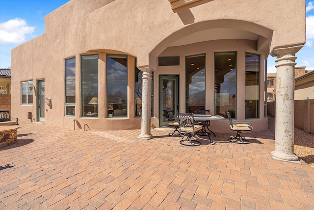 view of patio featuring fence