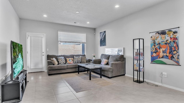 living room with visible vents, baseboards, recessed lighting, light tile patterned flooring, and a textured ceiling