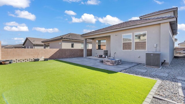 889 Tazanita Loop SE, Rio Rancho, NM 87124 - back of property featuring cooling unit, a patio, and stucco siding