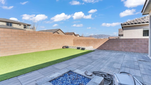 view of patio with a fenced backyard