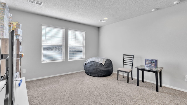 889 Tazanita Loop SE, Rio Rancho, NM 87124 - living area featuring carpet flooring, a textured ceiling, and baseboards