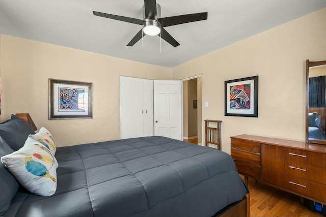 bedroom featuring ceiling fan and wood finished floors