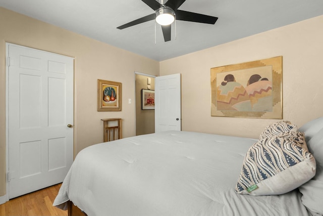 bedroom with ceiling fan and wood finished floors