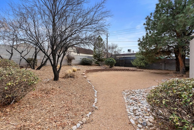 view of yard with a fenced backyard