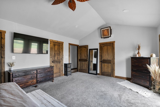 carpeted bedroom with baseboards, lofted ceiling, and ceiling fan