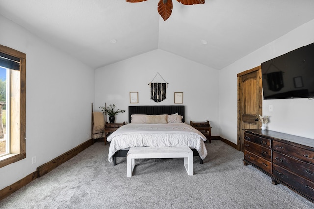 bedroom with light colored carpet, baseboards, a ceiling fan, and vaulted ceiling