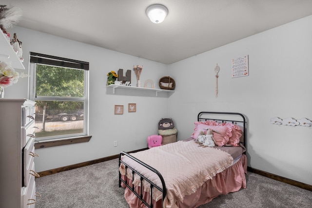 carpeted bedroom featuring baseboards