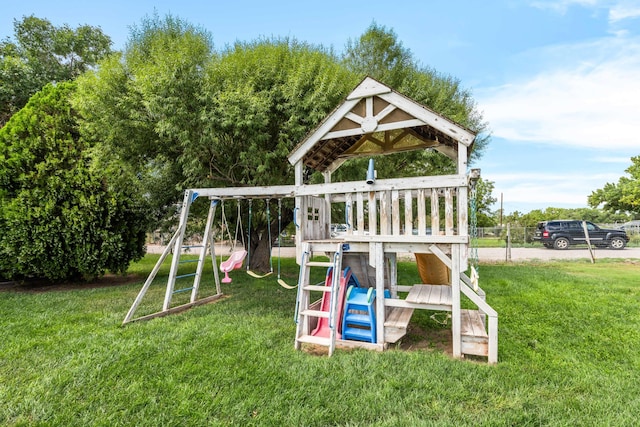 view of playground with a lawn