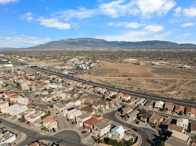 birds eye view of property featuring a mountain view and a residential view