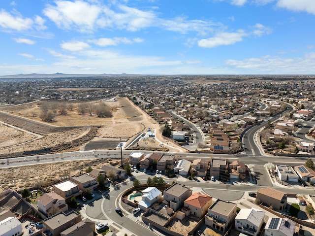 8104 Sleeping Bear Dr NW, Albuquerque, NM 87120 - aerial view of property and surrounding area featuring nearby suburban area and a mountain backdrop