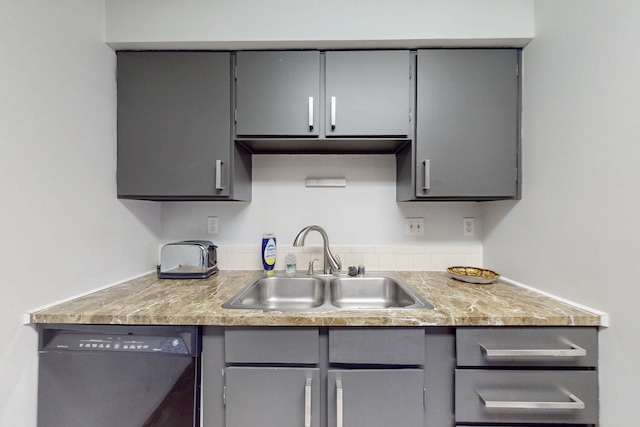 kitchen with a sink, gray cabinets, dishwasher, and light countertops