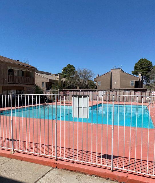 community pool featuring fence