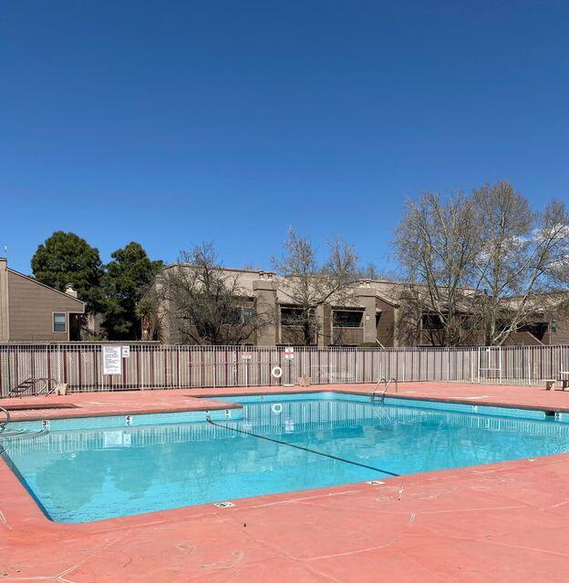 pool featuring fence