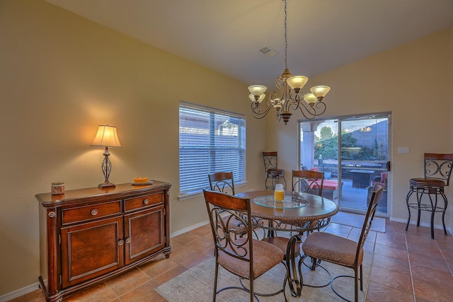 dining area featuring vaulted ceiling, a chandelier, visible vents, and baseboards