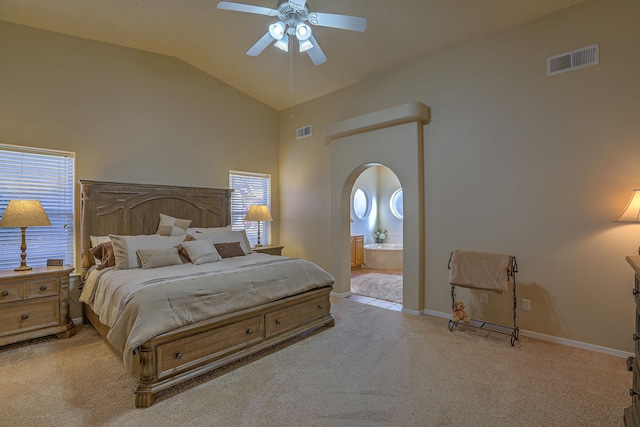 bedroom featuring light carpet, arched walkways, visible vents, and baseboards