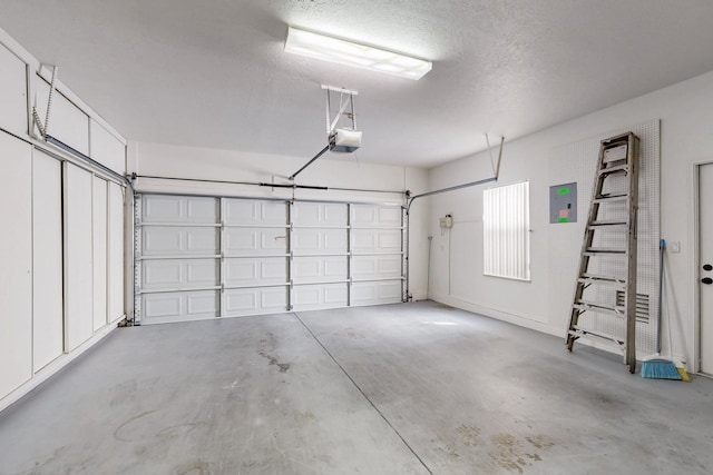 garage featuring a garage door opener and electric panel