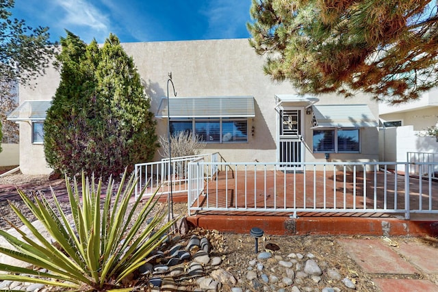 exterior space featuring stucco siding