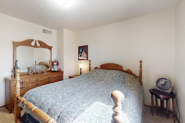 bedroom featuring light carpet and visible vents