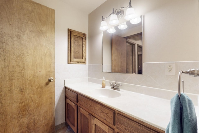 bathroom with tile walls and vanity