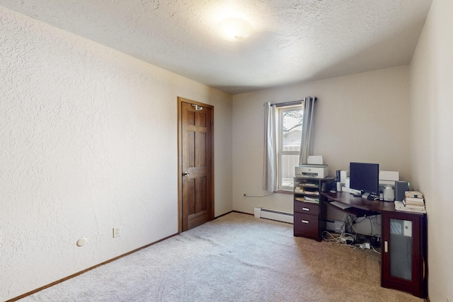 home office with a textured ceiling, baseboard heating, carpet flooring, and a textured wall