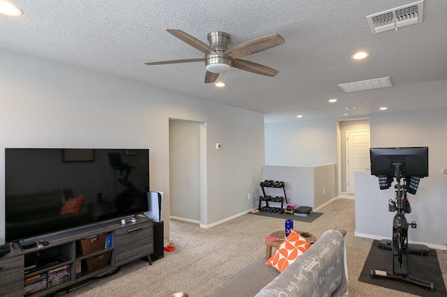 exercise room with carpet floors, recessed lighting, visible vents, a textured ceiling, and baseboards