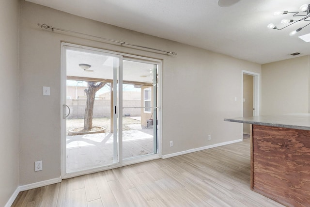 interior space with light wood-type flooring and baseboards