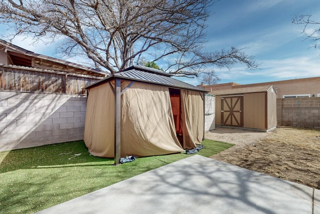 view of shed featuring a fenced backyard