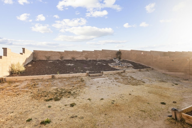 view of yard with a fenced backyard