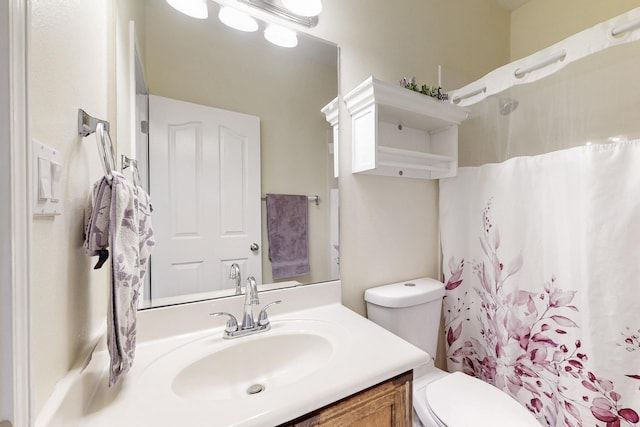 full bath featuring curtained shower, vanity, and toilet