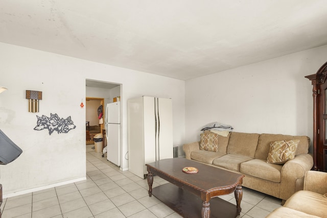 living room with visible vents and light tile patterned flooring