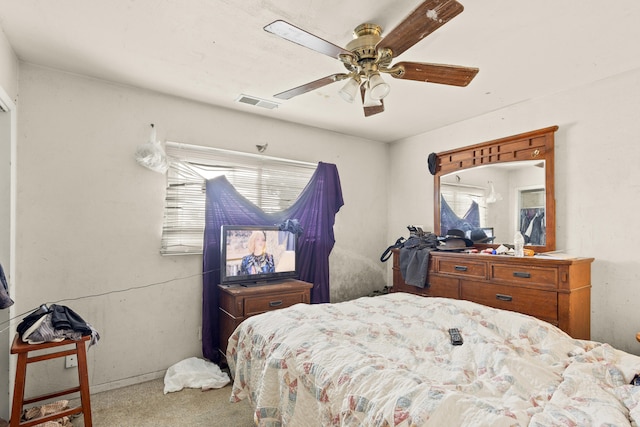 bedroom featuring carpet, visible vents, and ceiling fan