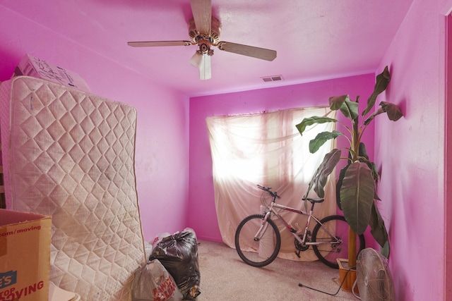 miscellaneous room with ceiling fan, visible vents, and light colored carpet