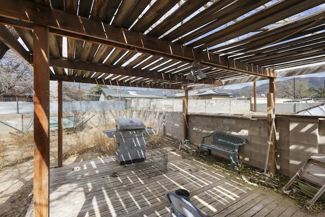 view of patio with area for grilling, a mountain view, and a pergola