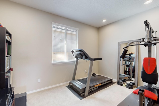 workout room featuring carpet, a textured ceiling, baseboards, and recessed lighting