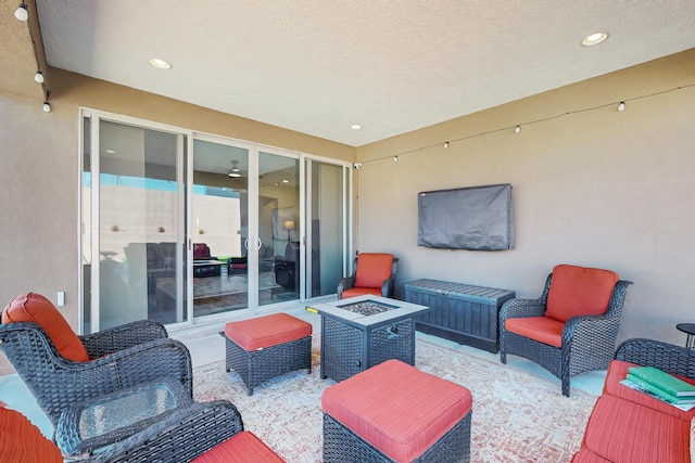 view of patio / terrace featuring an outdoor fire pit