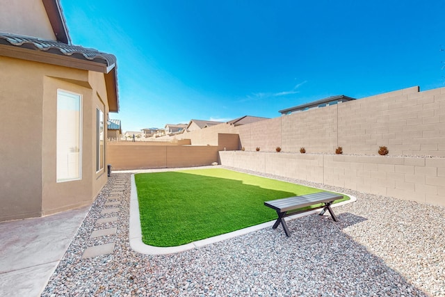 view of yard featuring a fenced backyard and a patio