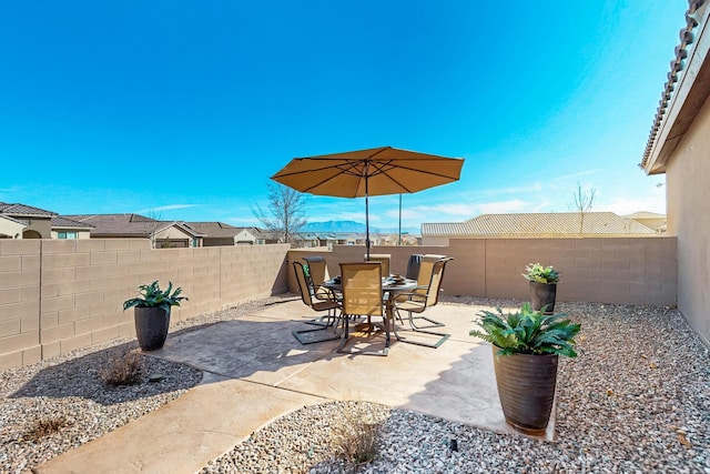 view of patio / terrace featuring outdoor dining space and a fenced backyard