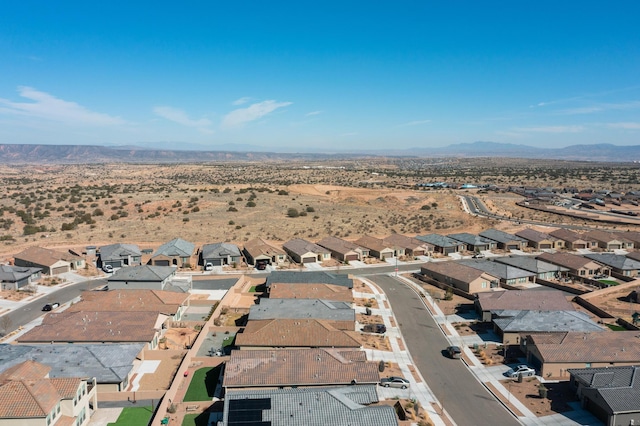 birds eye view of property featuring a mountain view and a residential view