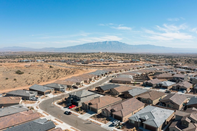 drone / aerial view featuring a residential view and a mountain view