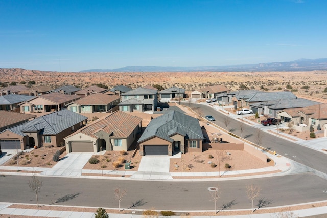 drone / aerial view with a mountain view and a residential view