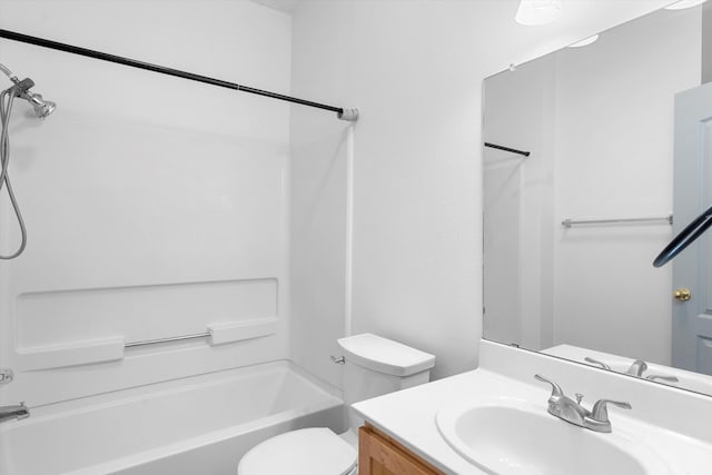 full bathroom with bathtub / shower combination, vanity, and toilet