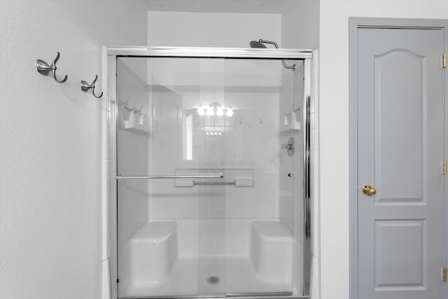 bathroom with a stall shower