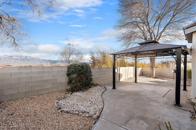 view of yard with a patio area, a fenced backyard, and a gazebo