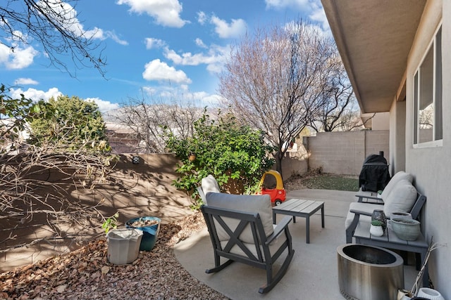 view of patio / terrace featuring a fenced backyard and an outdoor living space